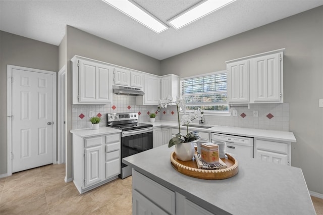 kitchen with electric stove, white cabinets, and dishwasher