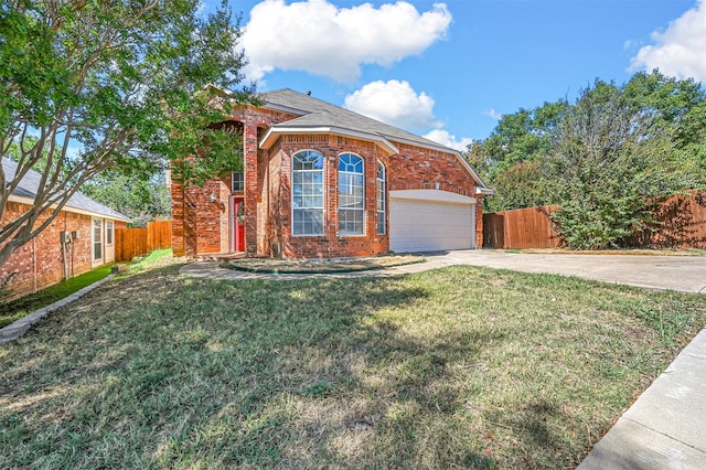 front of property featuring a garage and a front lawn