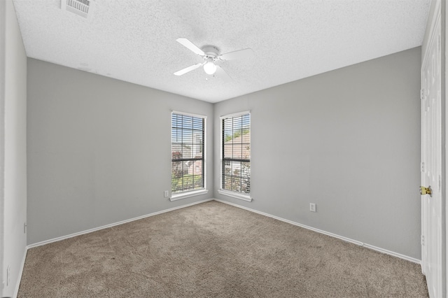 unfurnished room with carpet floors, a textured ceiling, and ceiling fan