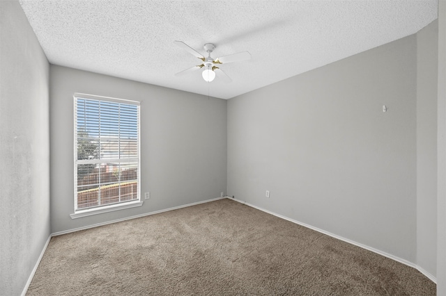 unfurnished room featuring ceiling fan, a textured ceiling, and carpet flooring