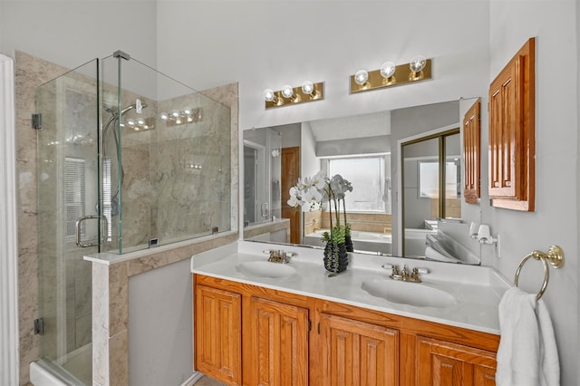 bathroom with a shower with door and vanity