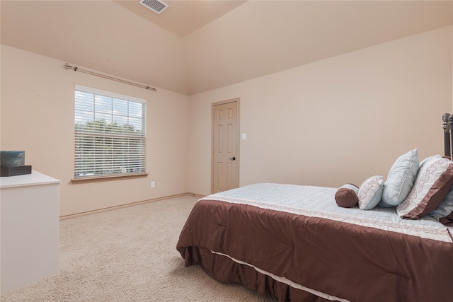 carpeted bedroom featuring lofted ceiling