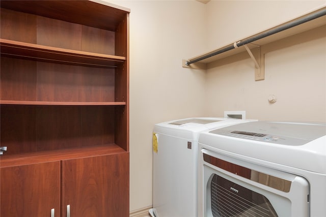 laundry room featuring independent washer and dryer