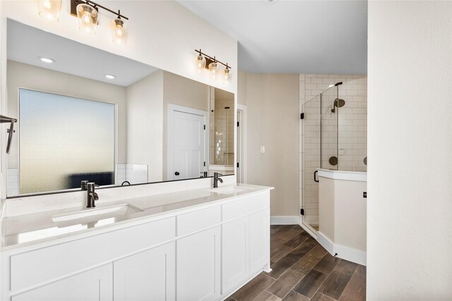 bathroom with vanity and walk in shower