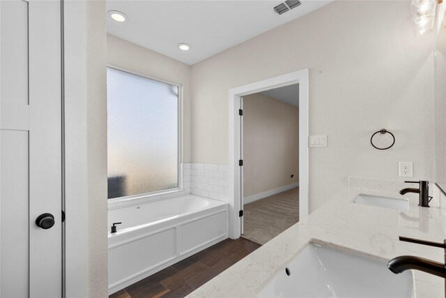 bathroom featuring vanity, toilet, and wood-type flooring