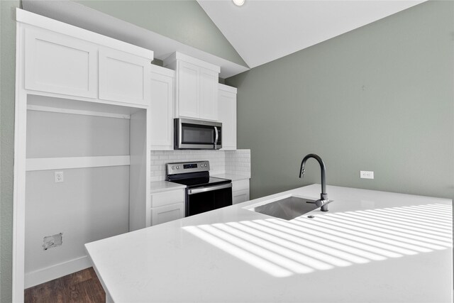 additional living space featuring dark hardwood / wood-style floors and vaulted ceiling