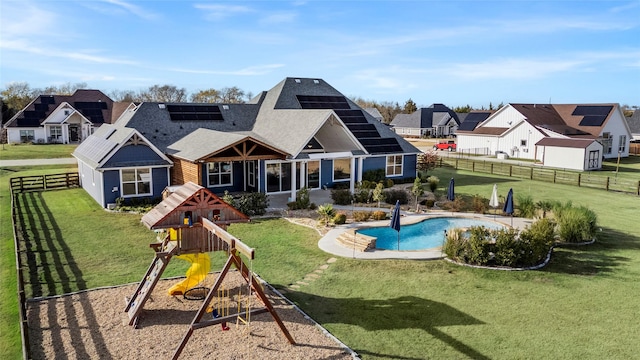 view of jungle gym featuring a lawn