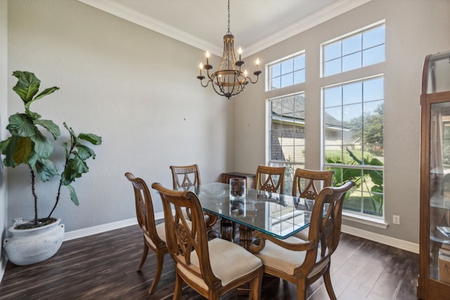 dining room with ornamental molding, dark hardwood / wood-style floors, and a notable chandelier