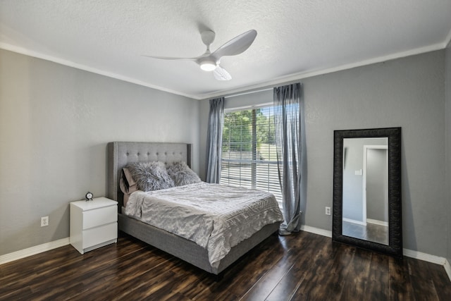 bedroom featuring ceiling fan, dark hardwood / wood-style floors, ornamental molding, and a textured ceiling