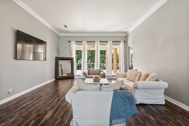 living room featuring dark hardwood / wood-style flooring and crown molding