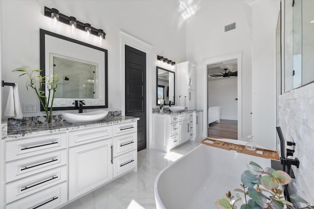 14098 County Road 2858, Eustace, TX 75124 - full bath featuring a sink, a freestanding bath, ceiling fan, and visible vents