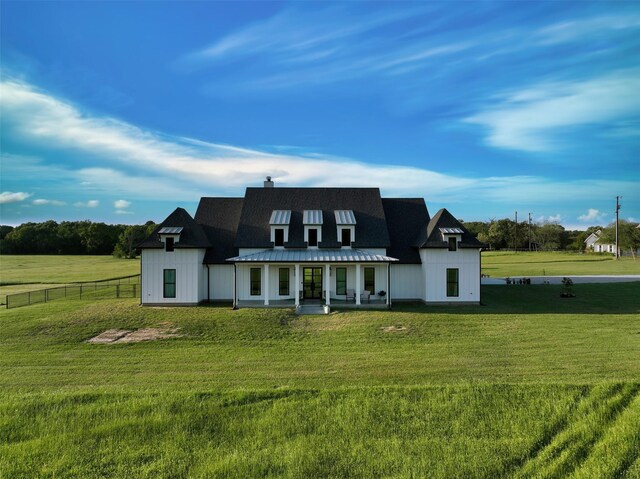 14098 County Road 2858, Eustace, TX 75124 - back of house with metal roof, fence, a yard, and covered porch