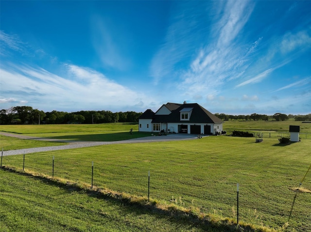 14098 County Road 2858, Eustace, TX 75124 - view of front facade featuring a rural view, aphalt driveway, fence, and a front yard