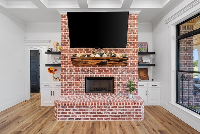 14098 County Road 2858, Eustace, TX 75124 - unfurnished living room with baseboards, ornamental molding, light wood-style flooring, and a brick fireplace