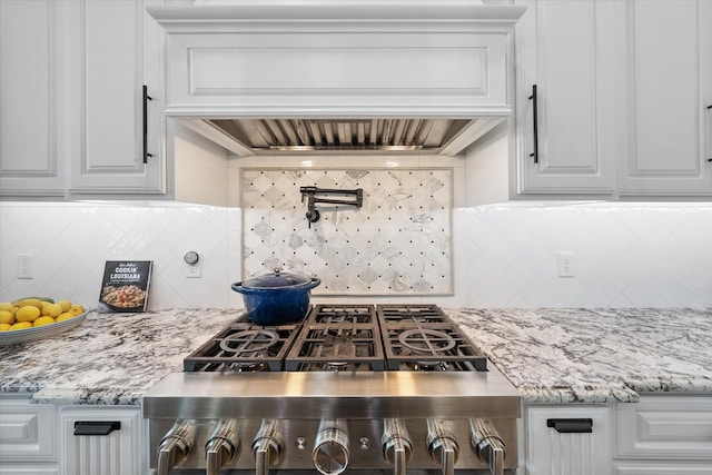14098 County Road 2858, Eustace, TX 75124 - interior space featuring custom range hood, backsplash, white cabinets, and gas cooktop