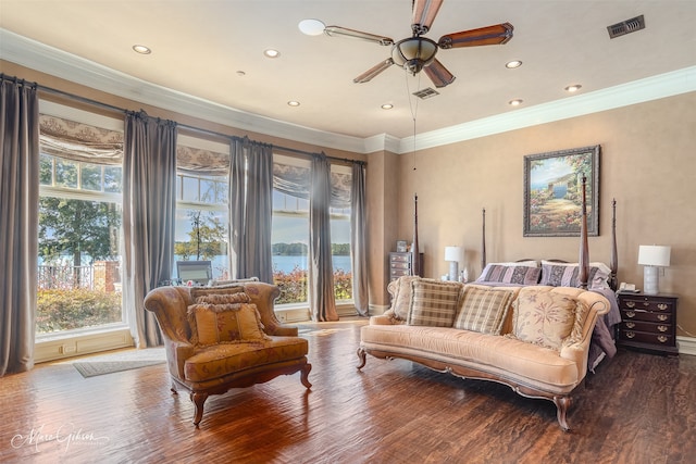 bedroom with a water view, wood-type flooring, and ceiling fan