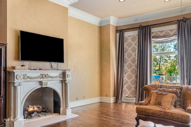 living room with wood-type flooring and ornamental molding