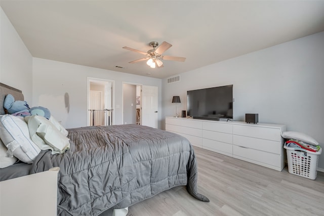 bedroom featuring light wood-type flooring and ceiling fan