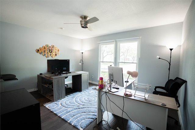 office area with ceiling fan and dark hardwood / wood-style flooring