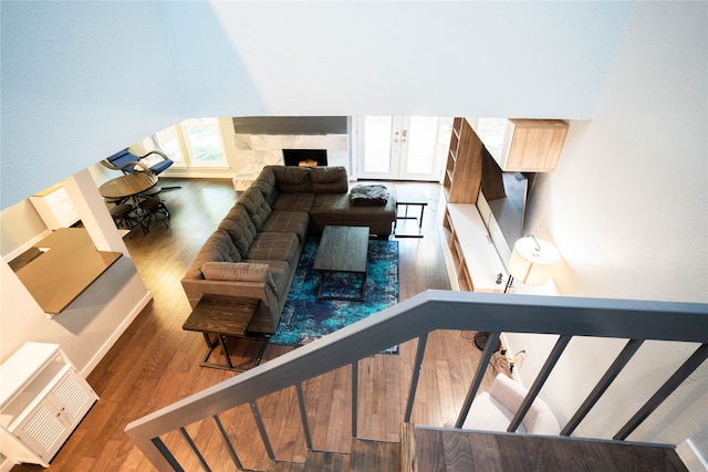 living room with hardwood / wood-style floors, french doors, and plenty of natural light