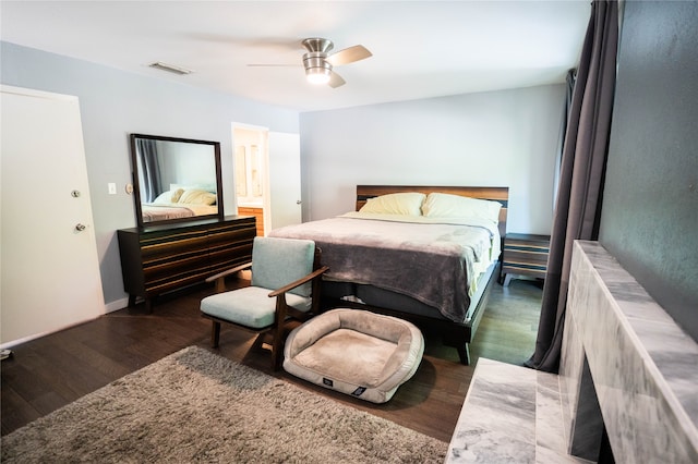 bedroom with dark wood-type flooring and ceiling fan