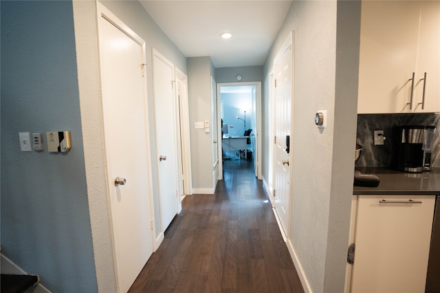 hallway featuring dark hardwood / wood-style flooring