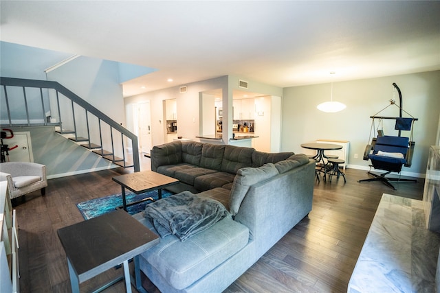 living room with dark hardwood / wood-style flooring