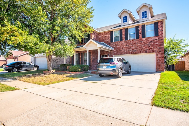 view of front of property with central AC, a front yard, and a garage