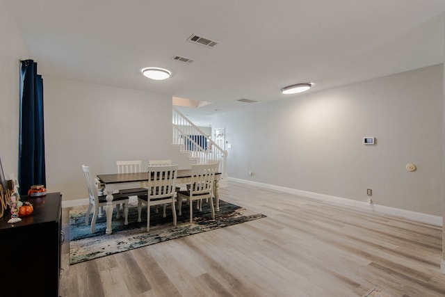 dining room with light hardwood / wood-style floors