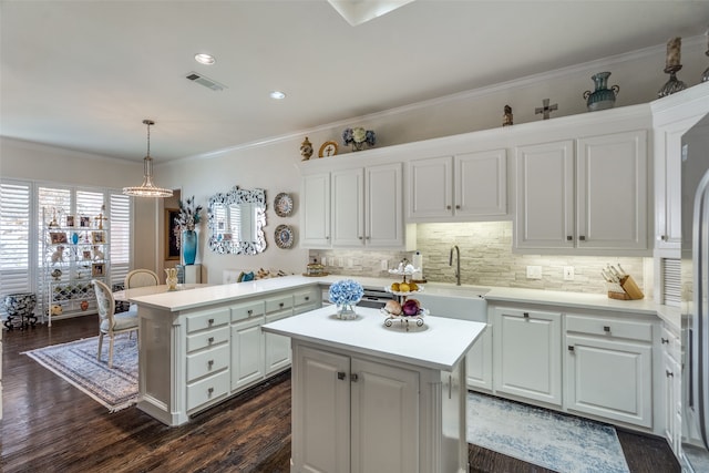 kitchen featuring a kitchen island and white cabinetry