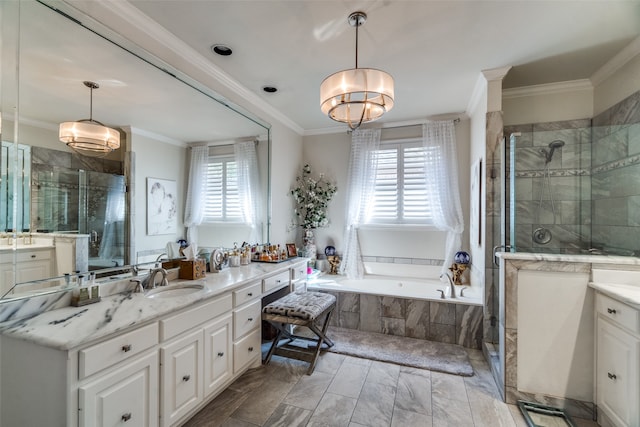 bathroom with shower with separate bathtub, vanity, and a healthy amount of sunlight