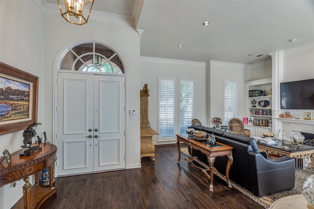 entrance foyer featuring a notable chandelier, plenty of natural light, dark hardwood / wood-style floors, and crown molding