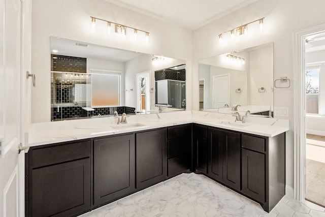 bathroom featuring vanity and an enclosed shower