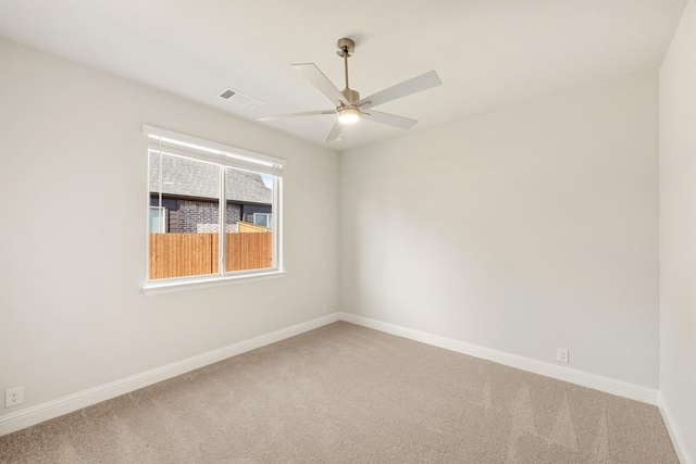 carpeted empty room with ceiling fan