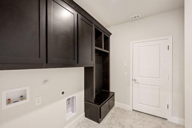 laundry area with cabinets, washer hookup, and electric dryer hookup