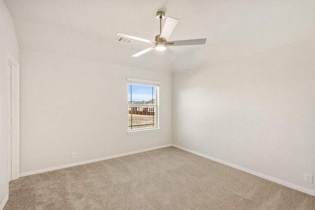 unfurnished room with light colored carpet and ceiling fan