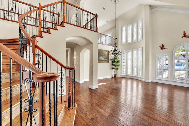 entryway featuring hardwood / wood-style flooring and high vaulted ceiling