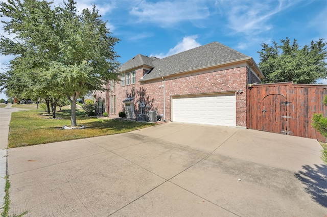 view of front of property with a front lawn and a garage