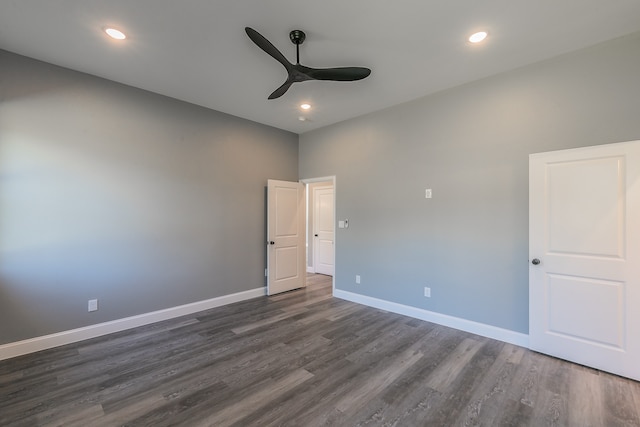 empty room featuring dark hardwood / wood-style floors and ceiling fan