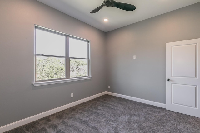 spare room featuring baseboards, recessed lighting, dark carpet, and ceiling fan