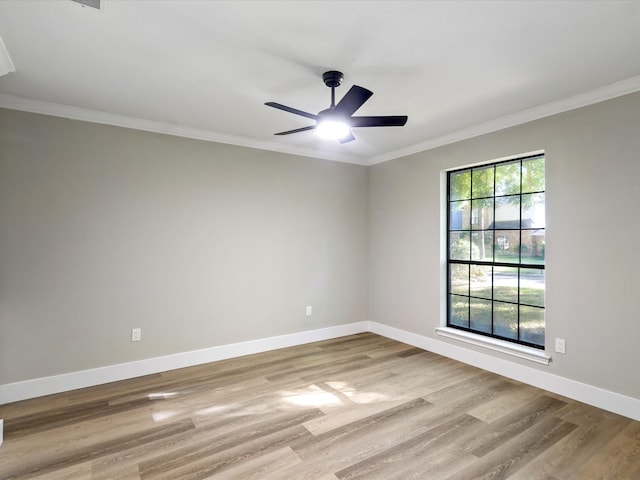 empty room with light hardwood / wood-style floors, ornamental molding, and ceiling fan