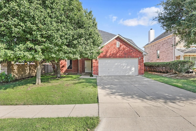 view of front of house with a garage and a front yard