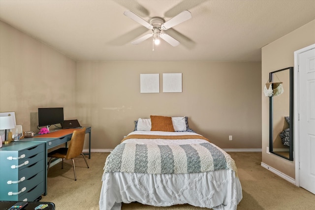 bedroom featuring ceiling fan and light colored carpet