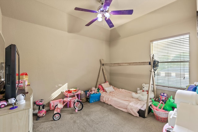 bedroom featuring carpet, lofted ceiling, and ceiling fan