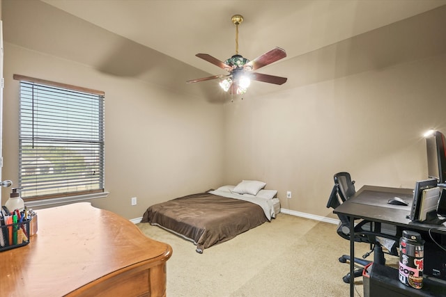 bedroom with ceiling fan and light carpet