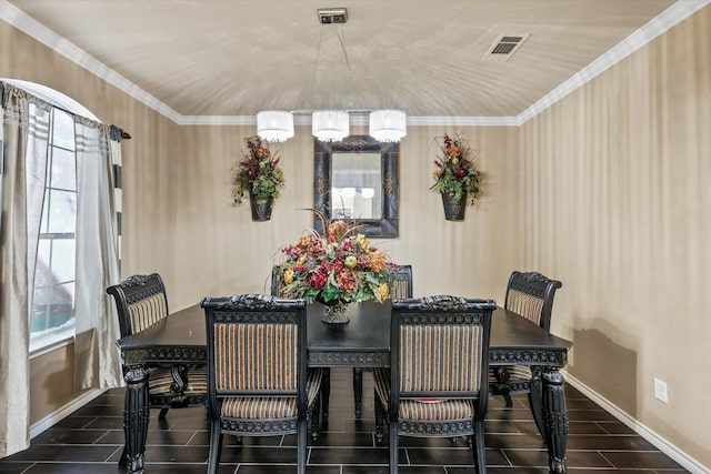 dining area featuring an inviting chandelier, ornamental molding, and a healthy amount of sunlight