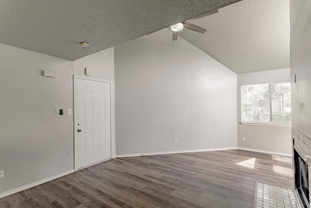 unfurnished living room featuring high vaulted ceiling, wood-type flooring, a textured ceiling, and ceiling fan