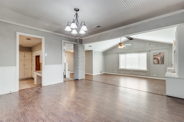 interior space featuring ceiling fan with notable chandelier, wood-type flooring, and decorative columns