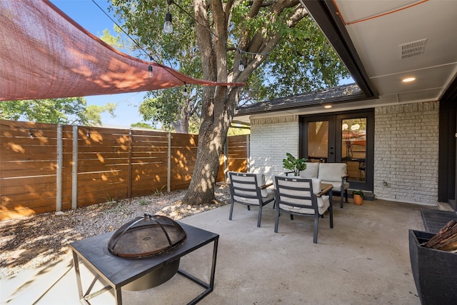 view of patio / terrace featuring a fire pit