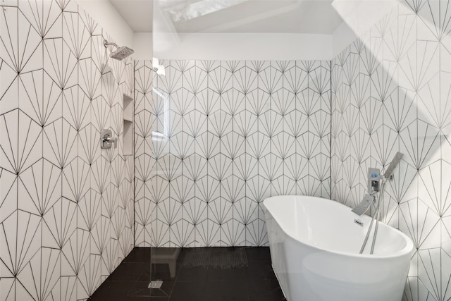 bathroom featuring tile walls, tile patterned flooring, and plus walk in shower